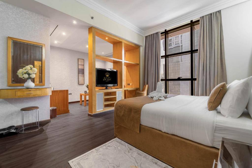 Spacious guest room with a king bed at The Leela Hotel Dubai
